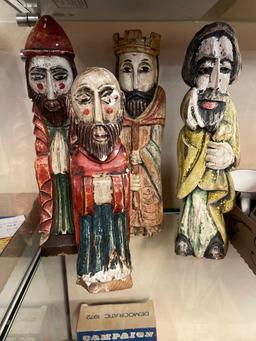 Four carved wooden Santas, tallest is 14 inches