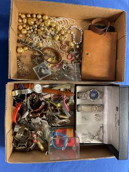 Two flats of costume jewelry and watches