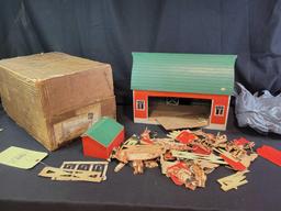 Red barn playset with cutout animals, people and accessories. Made of press wood and cardboard