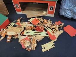 Red barn playset with cutout animals, people and accessories. Made of press wood and cardboard