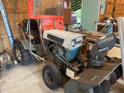 Early Sears super 12 tractor with a front now snowblower.