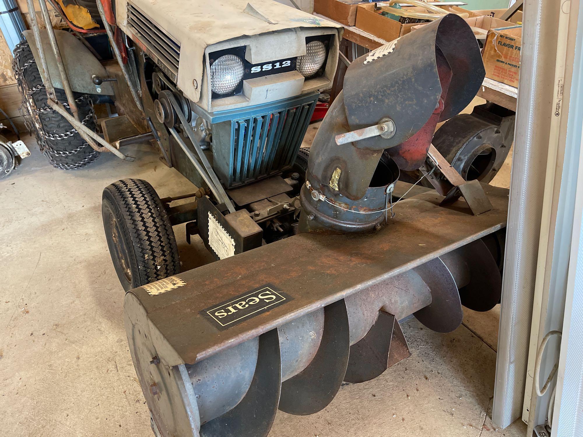 Early Sears super 12 tractor with a front now snowblower.
