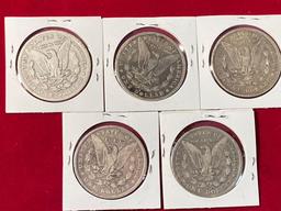 (5) Morgan silver dollars. Bid times five.