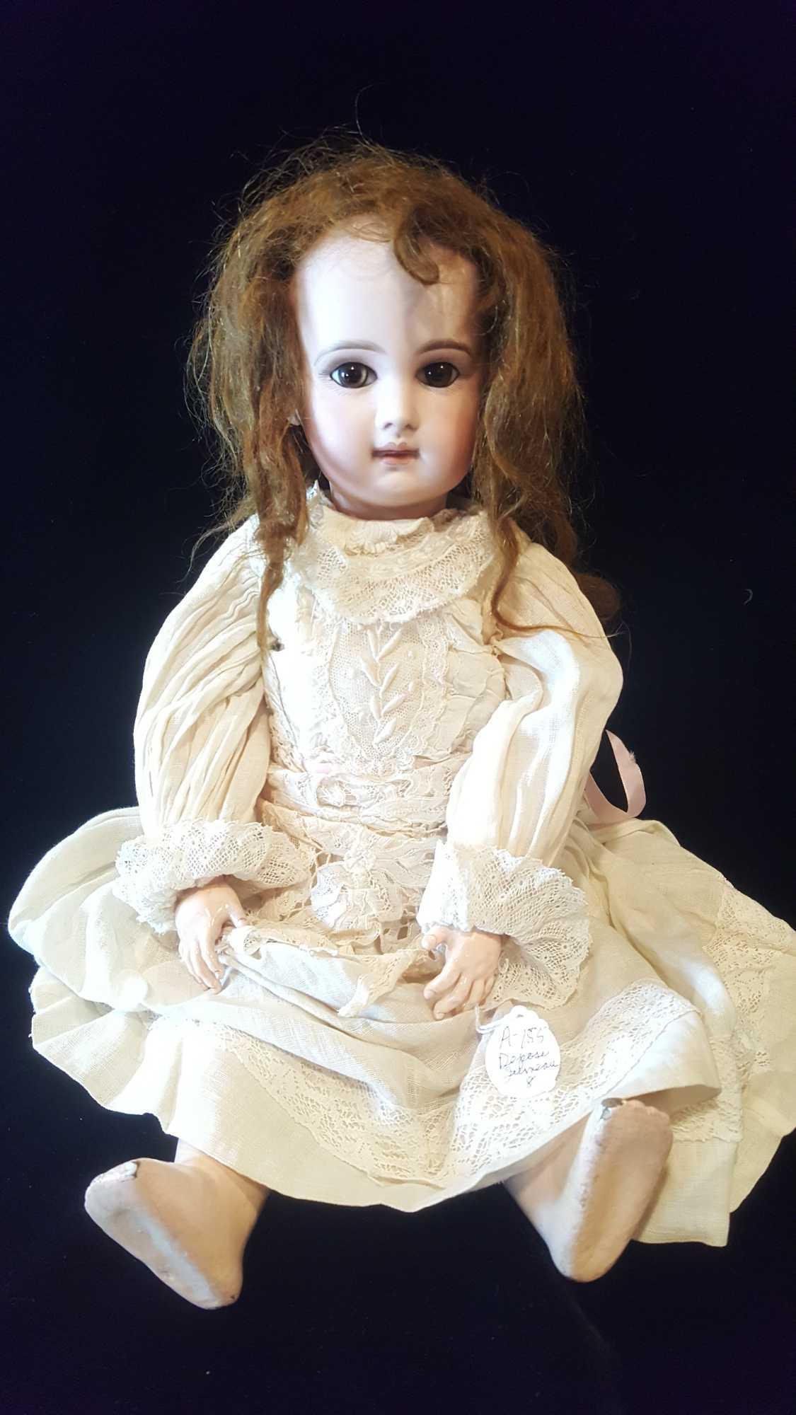 Antique French Jumeau doll, Paris, 19 inches, pierced and applied ears, brown glass eyes