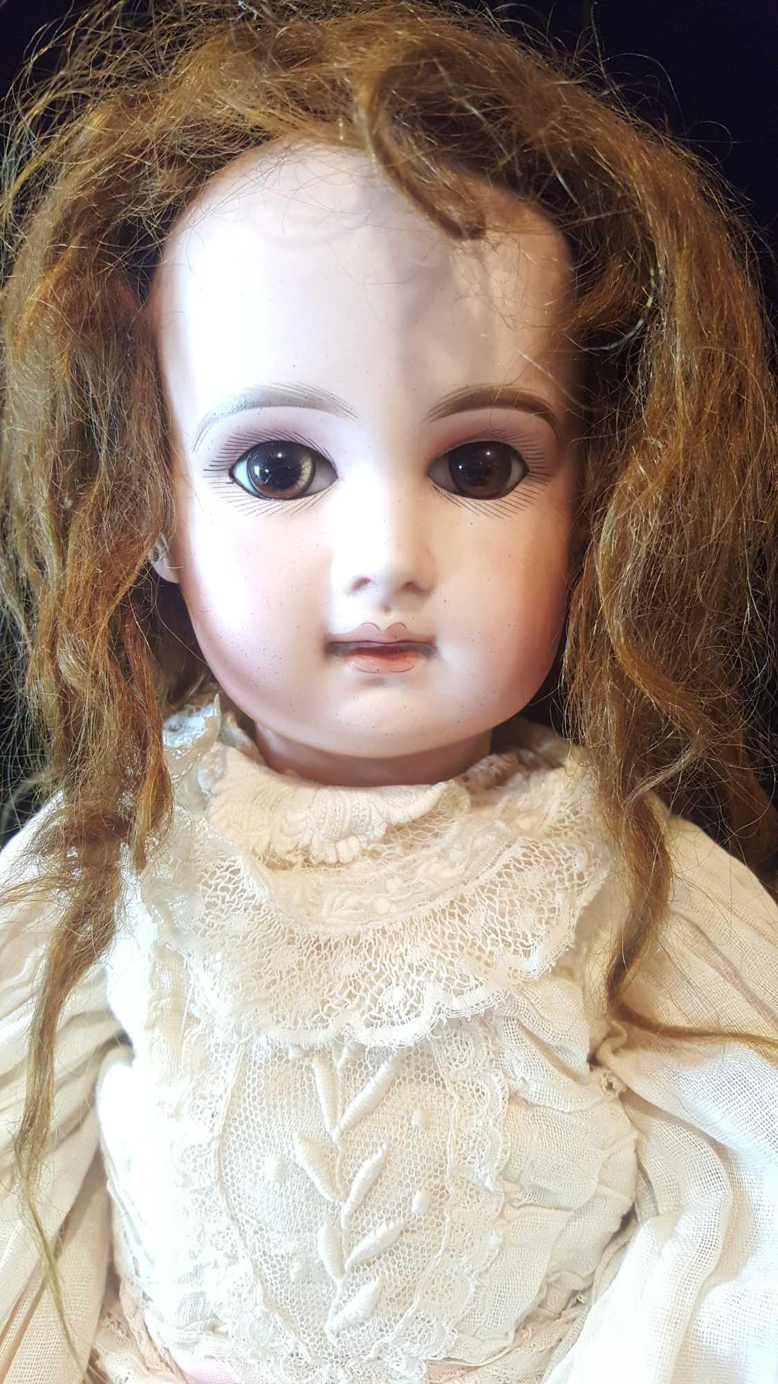 Antique French Jumeau doll, Paris, 19 inches, pierced and applied ears, brown glass eyes