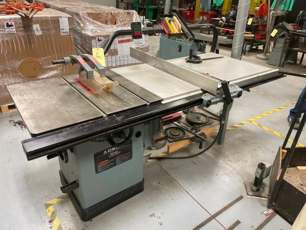 RM150 Delta 220 V Unisaw 10 in tilting arbor saw with layout table with used blades and guards