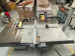 RM150 Delta 220 V Unisaw 10 in tilting arbor saw with layout table with used blades and guards