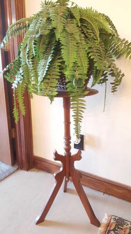 Antique plant stand with basket and faux fern