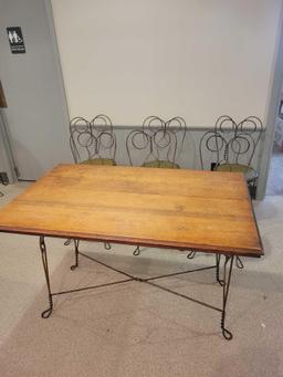 Oak parlor table with metal base and 6 matching chairs