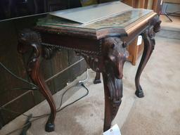 Heavily carved horse head table with decorative top