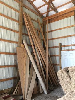 large lot of lumber and drain pipe.