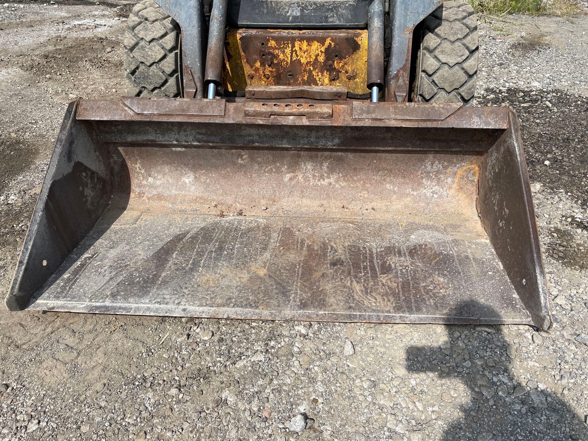 New Holland LS170 skid steer with 66in quick tack bucket