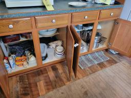 Contents of kitchen cabinets, pots, pans, junk drawers, covered corningware