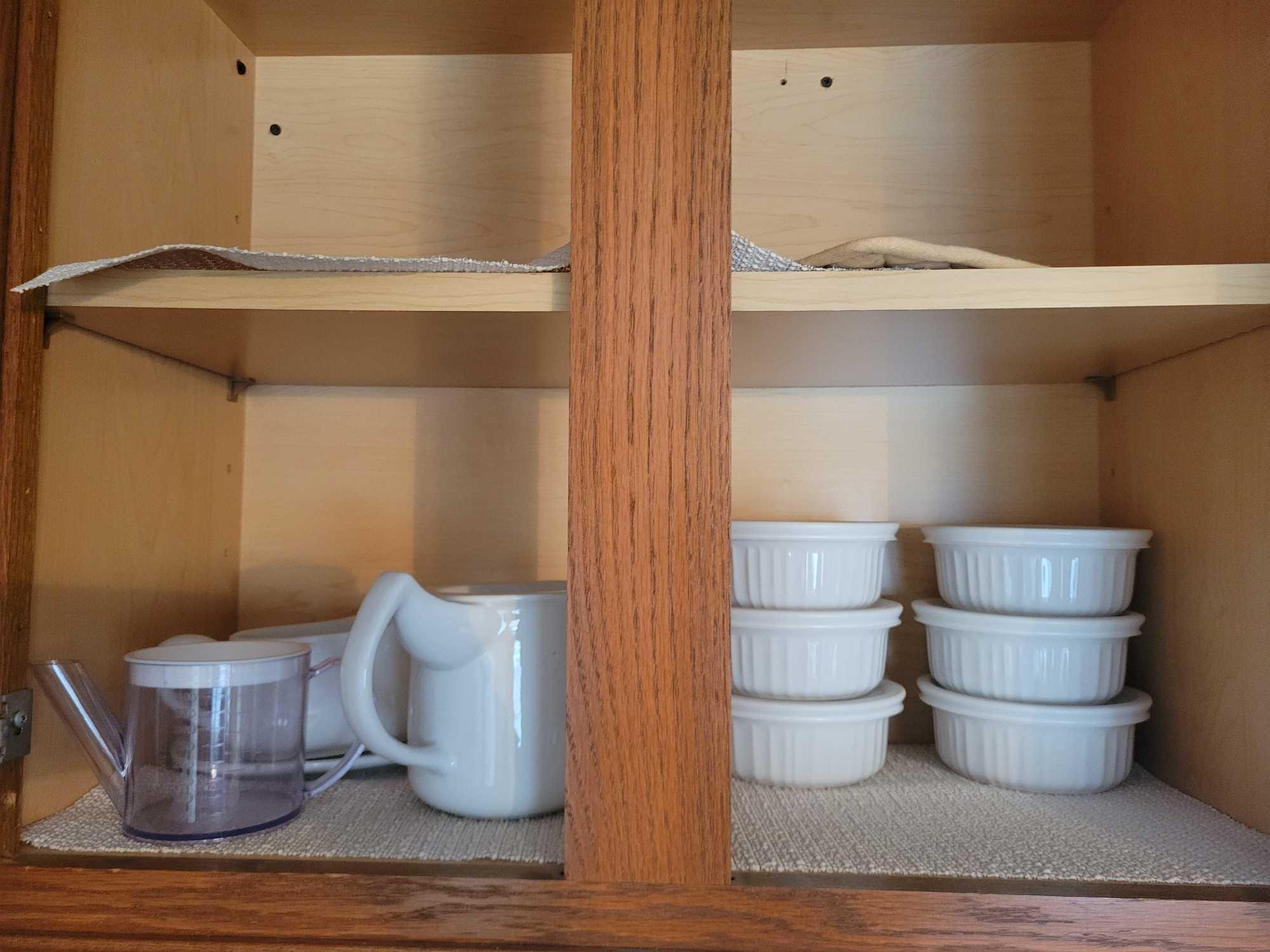 Contents of kitchen cabinets, pots, pans, junk drawers, covered corningware