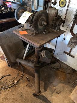 Grinder on Heavy Metal Rolling Stand