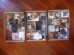 Assortment of costume jewelry - necklaces, earrings, pins, bracelets