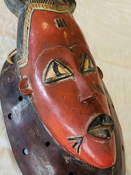 Polychrome painted African wooden mask