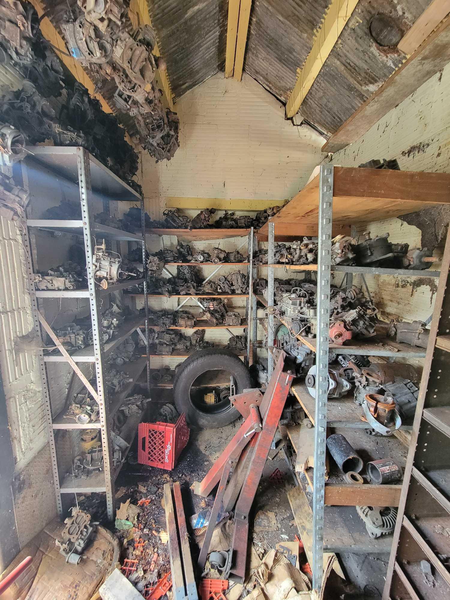 Contents of building, carburetors, engine stand, motor, scaffolding pieces, and more