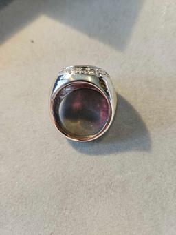 Platinum ring containing a red 15 x 11 mm oval 6 carat rubellite tourmaline