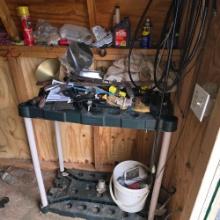 contents of two sheds. plastic and metal pipe - tubs and planters - hardware - lawn tool stand -