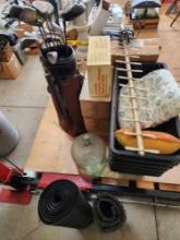 Golf Clubs, Telephone Dialer, glass winemaking jug, rubber mats,