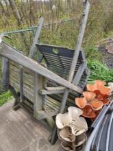 Wooden swing with canopy, hanging flower pots