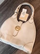 Michael Kors cream leather purse, $378, never carried