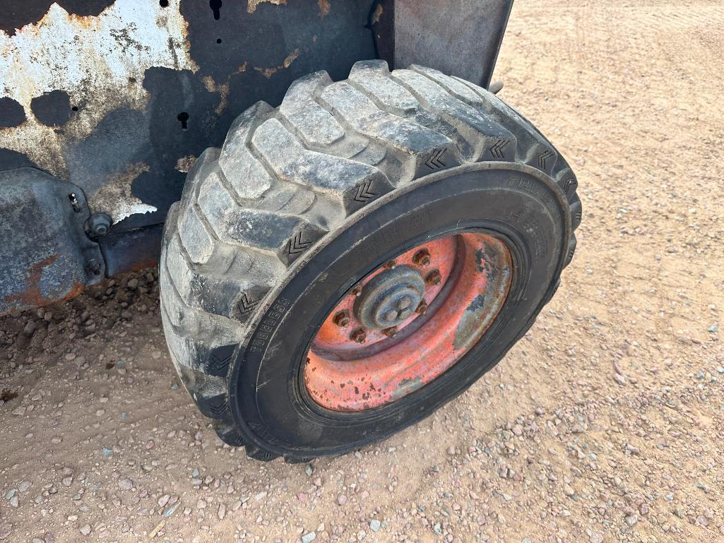 Bobcat S220 skid steer, cab w/AC, aux hyds, hand & foot controls, 12x16.5 tires, drive motors