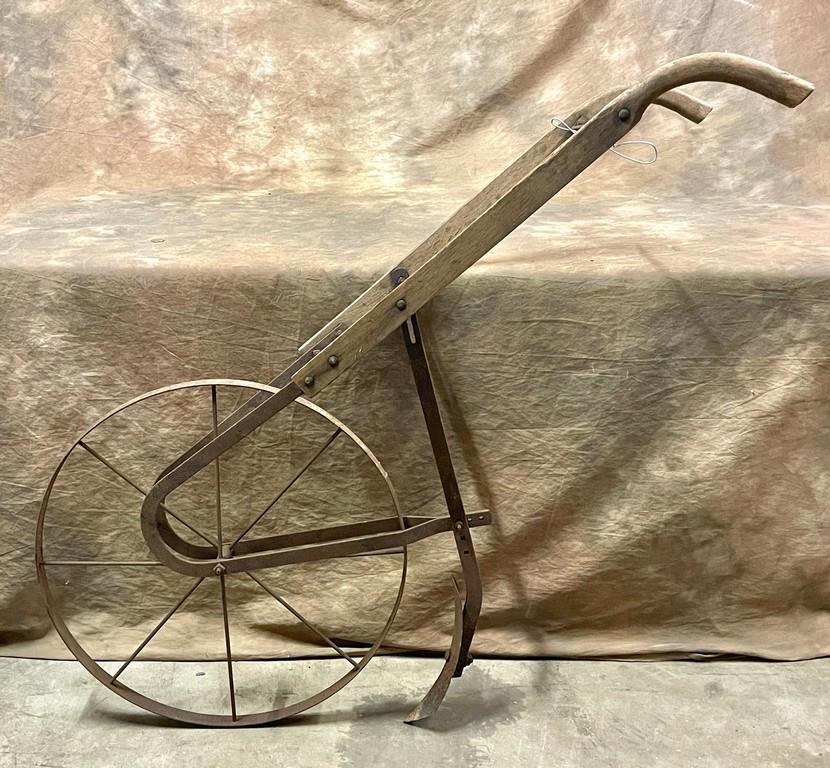 Antique Iron Wheel and Wood Handle Push Plow