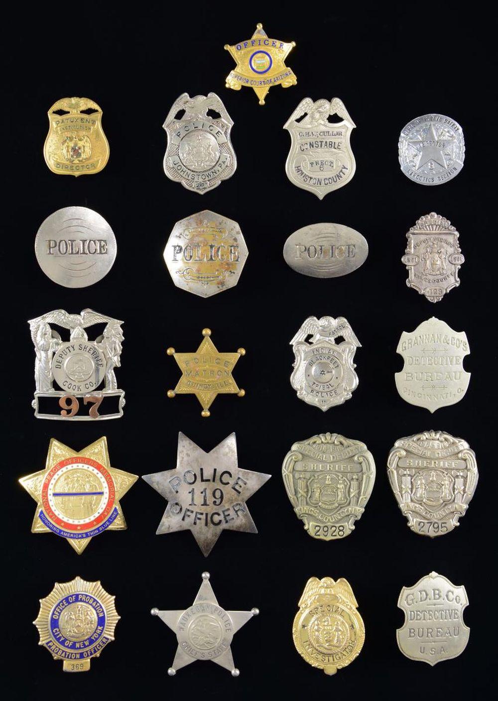 GROUP OF 21 POLICE & LAW ENFORCEMENT BADGES.