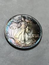 1987 1 oz. Silver American Eagle $1 BU Rainbow Toning