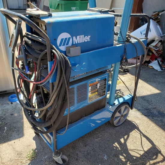 side yard Miller Dynasty 300DX welder requires 220 power source
