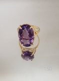 14KT YELLOW GOLD AND AMETHYST RING HAVING A 17 X 11.57 MM OVAL STONE (SIZE 7 3/4)