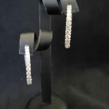 18KT & 4.64 CTW DIAMOND IN AND OUT HOOP EARRINGS: