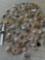 Assorted costume jewelry. Assorted pins, charms, cuff links, etc. Over 90 pieces