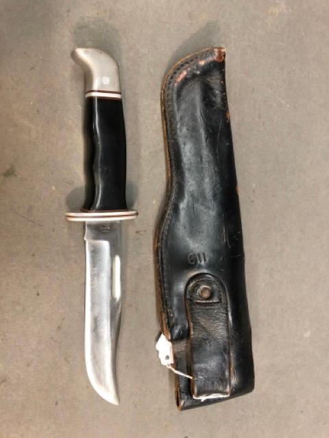 Buck knife with leather sheath