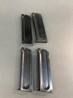Four Colt 1911 22LR magazines.