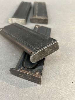 Four Colt 1911 22LR magazines.