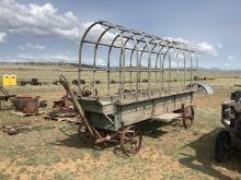 Horse-Drawn Covered Wagon on Iron Wheels