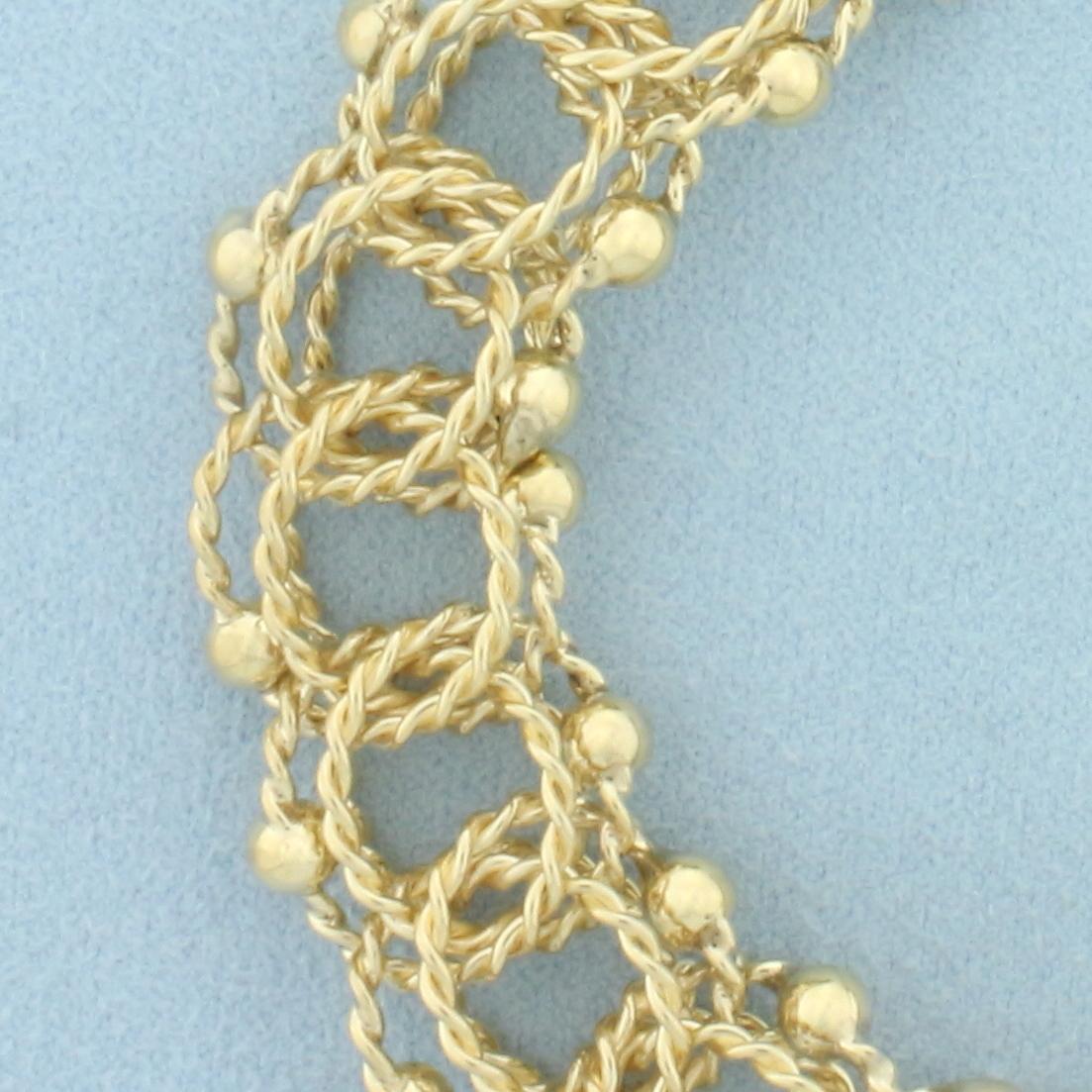 Wide Twisting Loop Rope Charm Bracelet In 14k Yellow Gold