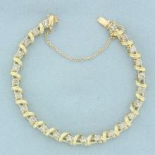 Designer Diamond Wrapped Ribbon Design Tennis Bracelet In 14k Yellow Gold