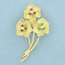 Vintage Dankner Emerald, Sapphire, Ruby, And Diamond Flower Pin In 18k Yellow Gold