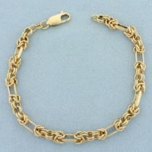 Italian Designer Knot And Oval Link Chain Bracelet In 14k Yellow Gold