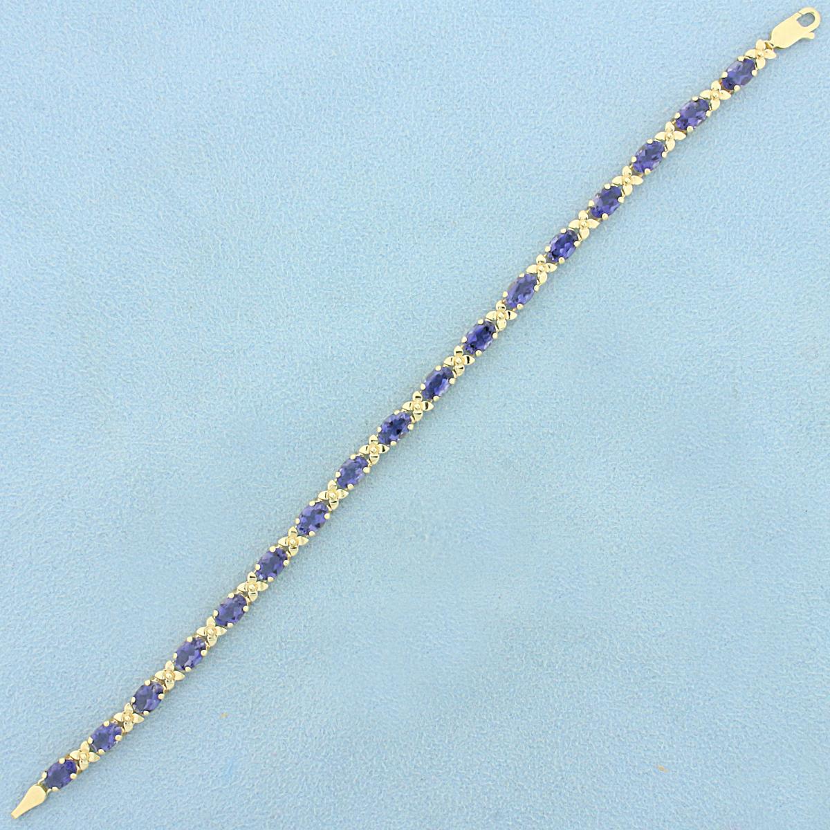 Aaa Tanzanite Flower Design Line Bracelet In 14k Yellow Gold