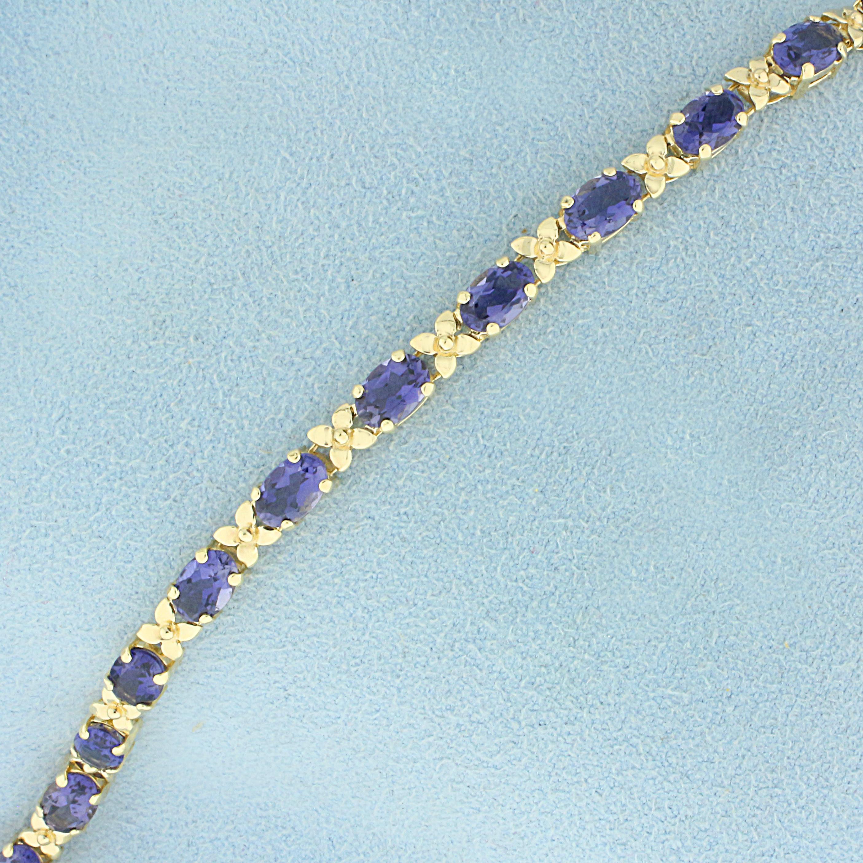 Aaa Tanzanite Flower Design Line Bracelet In 14k Yellow Gold