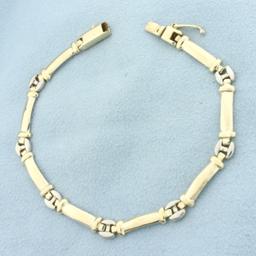 Two Tone Link Bracelet In 14k Yellow And White Gold