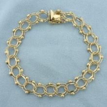 Double Loop Charm Bracelet In 14k Yellow Gold