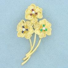 Designer Dankner Flower Pin With Emerald, Sapphire, Ruby, And Diamond In 18k Yellow Gold