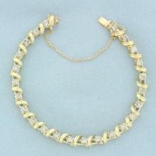 Spiral Ribbon Design Diamond Tennis Bracelet In 14k Yellow Gold