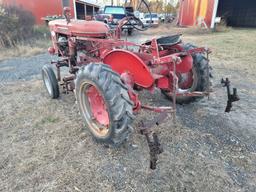 Farmall 140 with rolling basket and rear gang